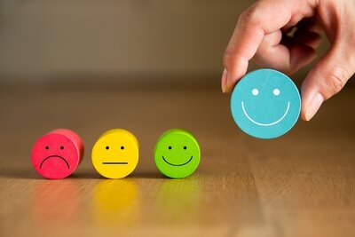 hands holding happy smiley face, good review, happy customer